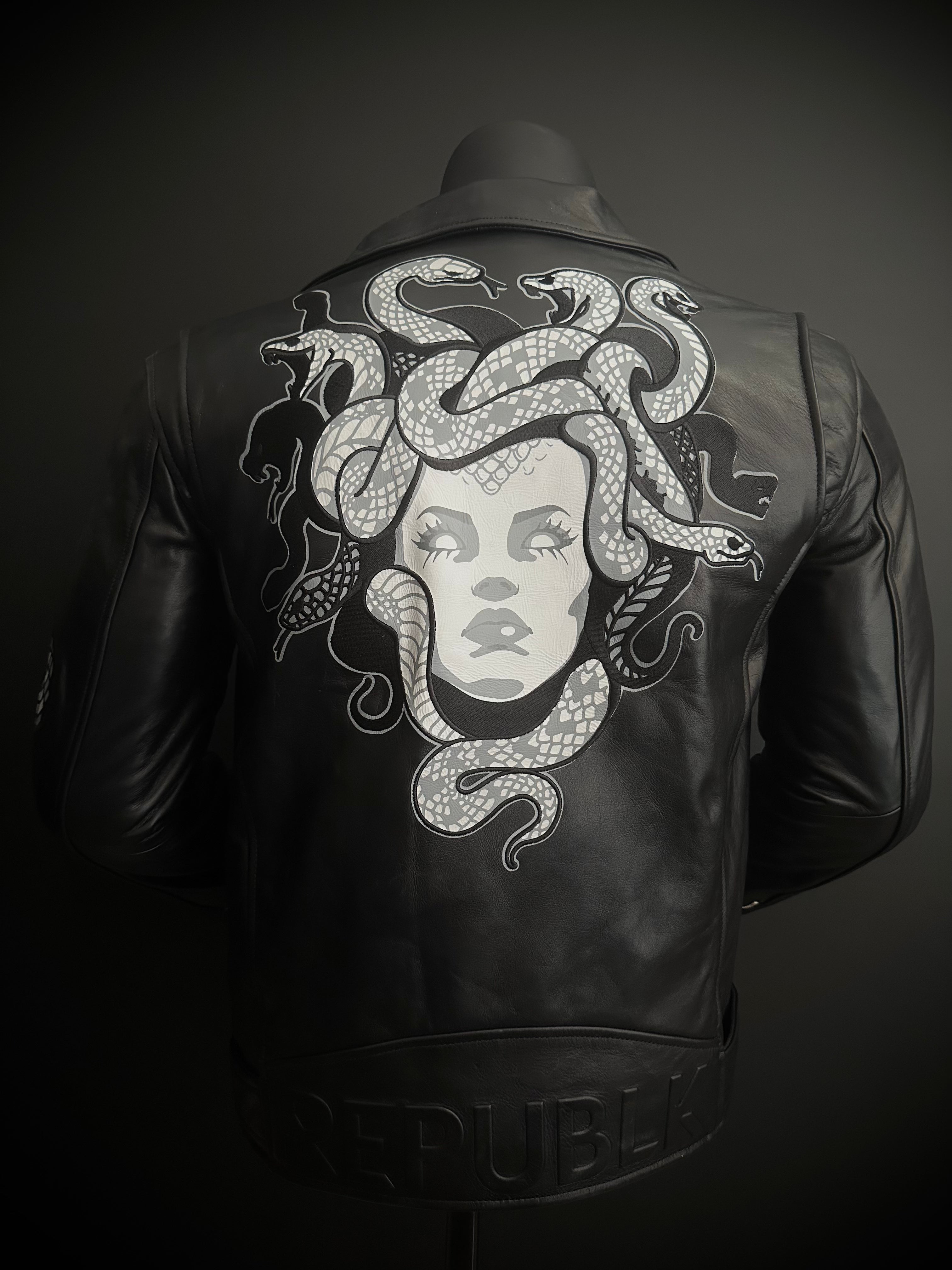 Full back view of black leather motorcycle jacket with Medusa-inspired tattoo artwork